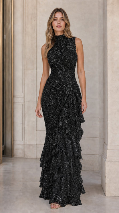 Model wearing black high neck sleeveless ruffle evening gown