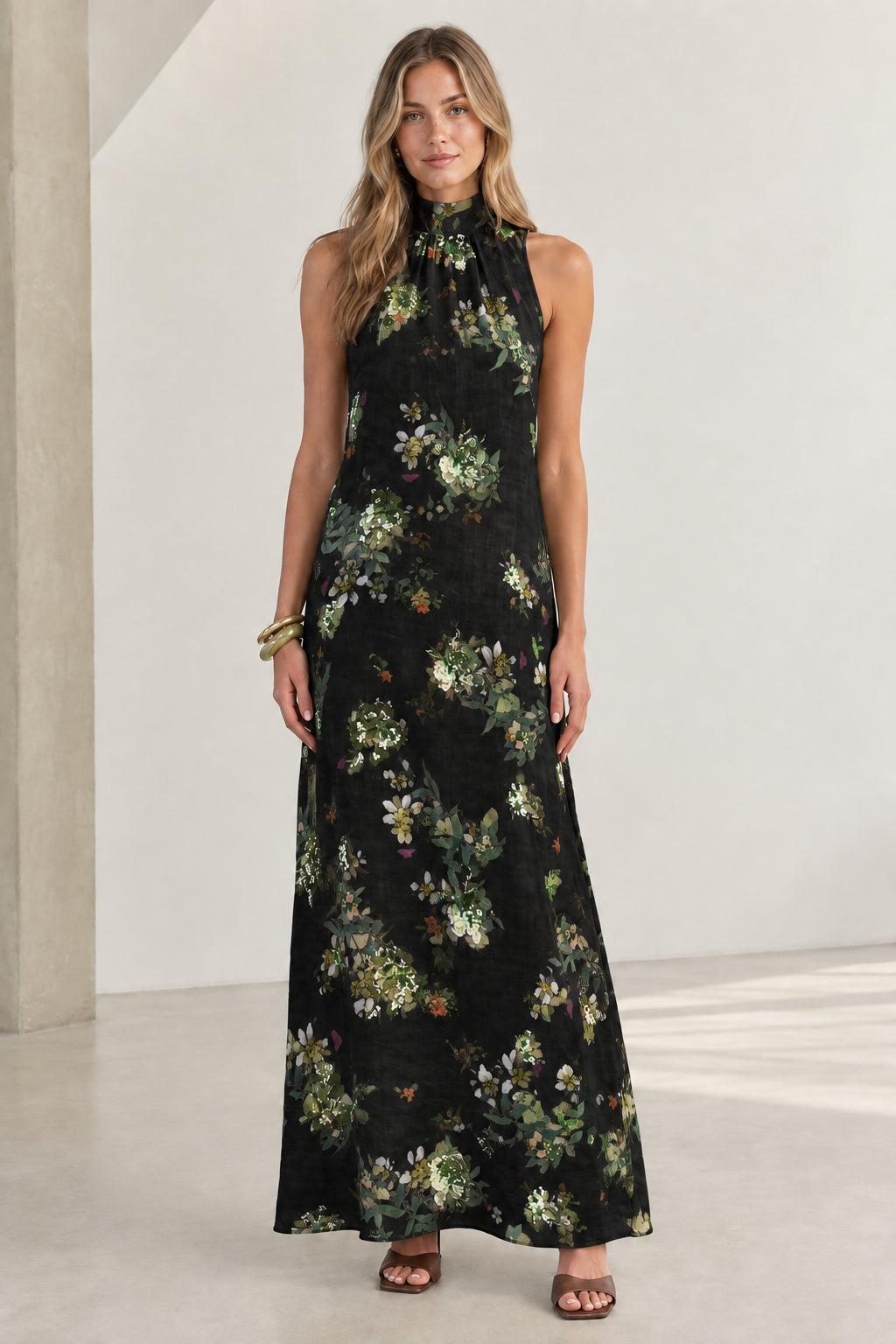 Front view of Black floral halter neck sleeveless maxi dress