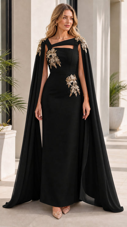 Woman wearing black evening dress with attached cape