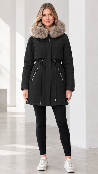 Front view of model wearing black faux fur hooded winter parka
