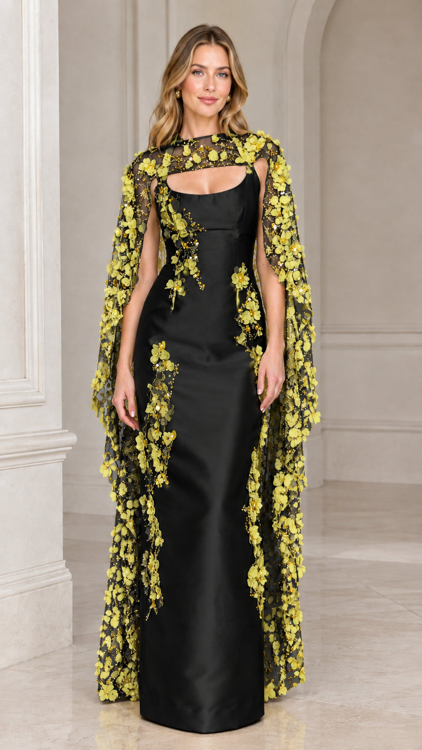 Black satin column evening gown featuring yellow floral embroidered sheer cape