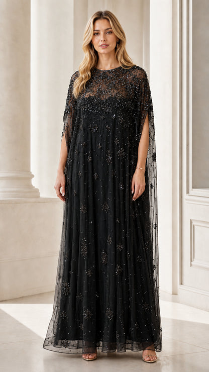 Front view of black beaded mesh cape maxi dress