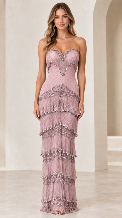 Front view of woman wearing mauve pink strapless beaded fringe formal dress