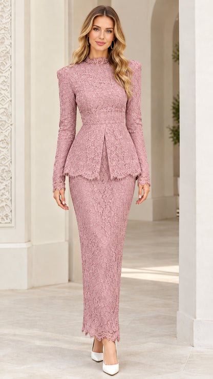 Front view of model wearing dusty pink lace peplum maxi evening gown