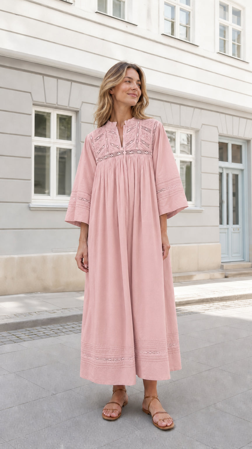 Woman wearing Dusty Pink boho lace-trim maxi dress with flared sleeves