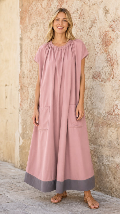 Model wearing Dusty Pink loose-fit gathered maxi dress with contrast hem