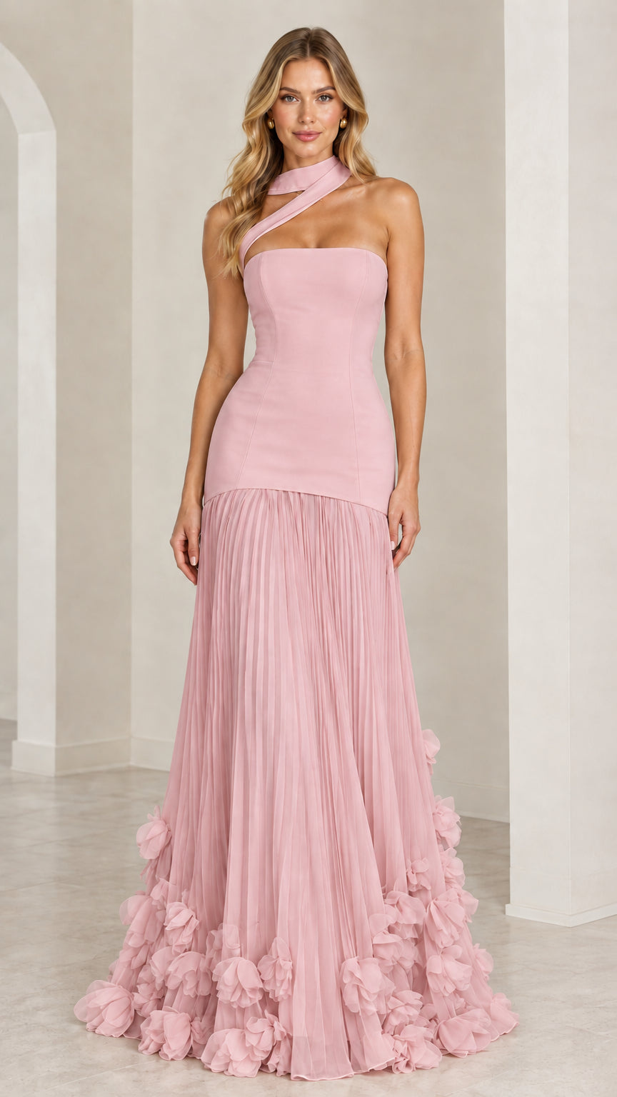 Model wearing the blush pink asymmetric pleated drop-waist evening gown