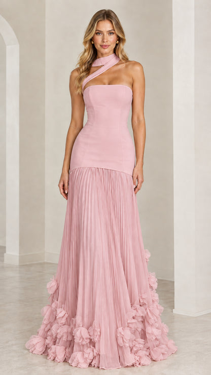 Model wearing the blush pink asymmetric pleated drop-waist evening gown