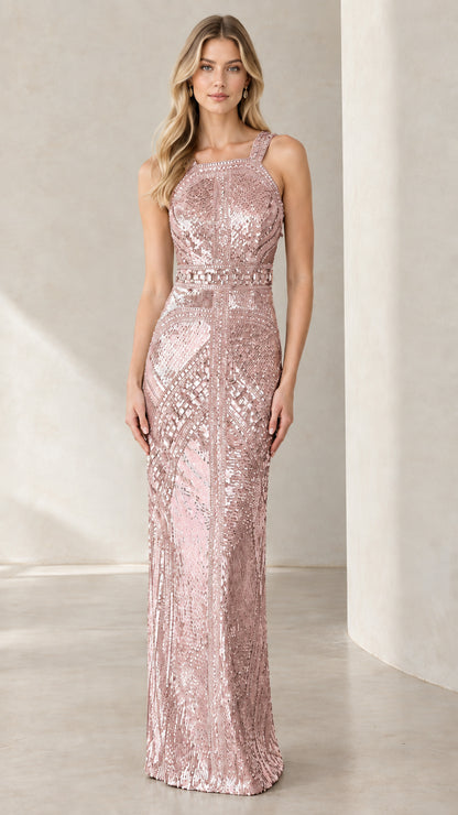Front full view of woman wearing blush pink geometric sequin column formal gown