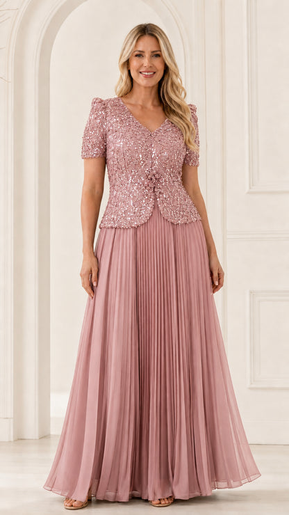 Full front view of blush pink sequined mother of the bride dress with pleated chiffon skirt
