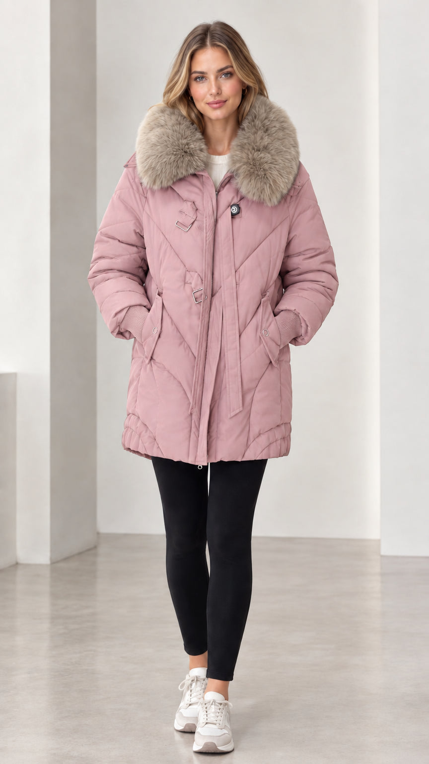 Front full-length view of model wearing dusty pink faux fur collar quilted puffer jacket