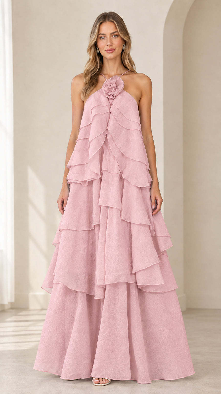 Full-length front view of model wearing Dusty Pink tiered ruffle halter gown