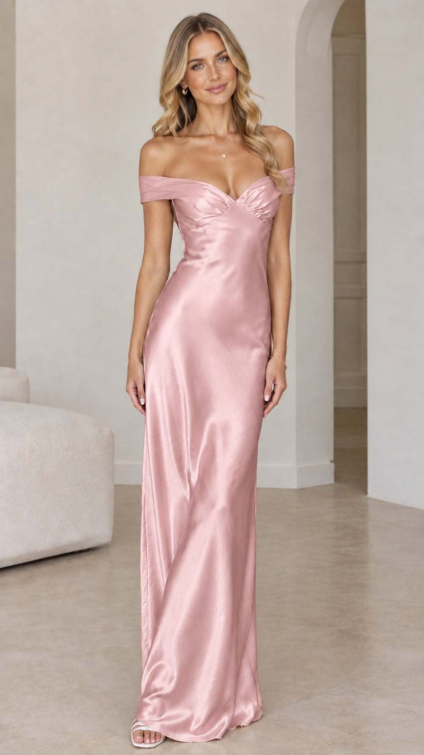 Front view of woman wearing blush pink off-the-shoulder satin maxi gown