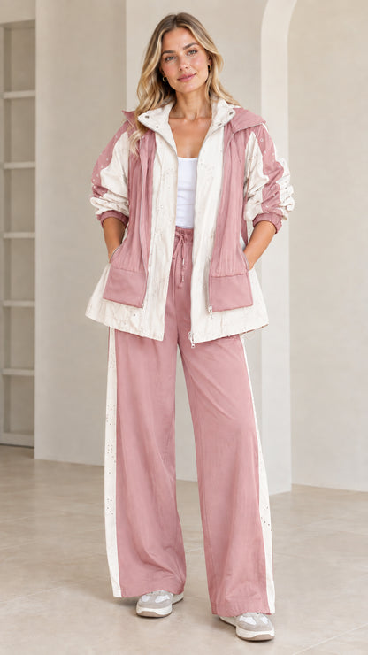 Full front view of dusty pink and cream two-piece hooded athleisure set