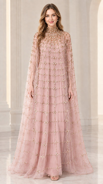 Front full view of woman wearing blush pink beaded cape evening gown