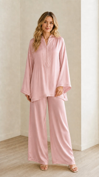 Full-length view of woman wearing the blush pink embroidered tunic and trousers set
