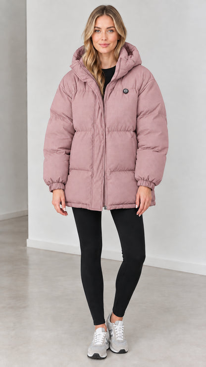 Front view of woman wearing dusty pink hooded quilted puffer jacket