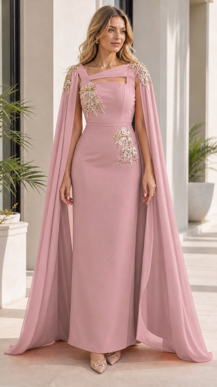 Woman wearing pink evening dress with attached cape
