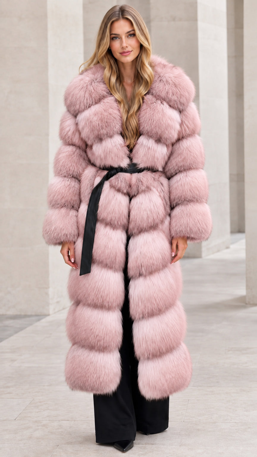 Front full-length view of woman wearing dusty pink long tiered faux fur coat with belt