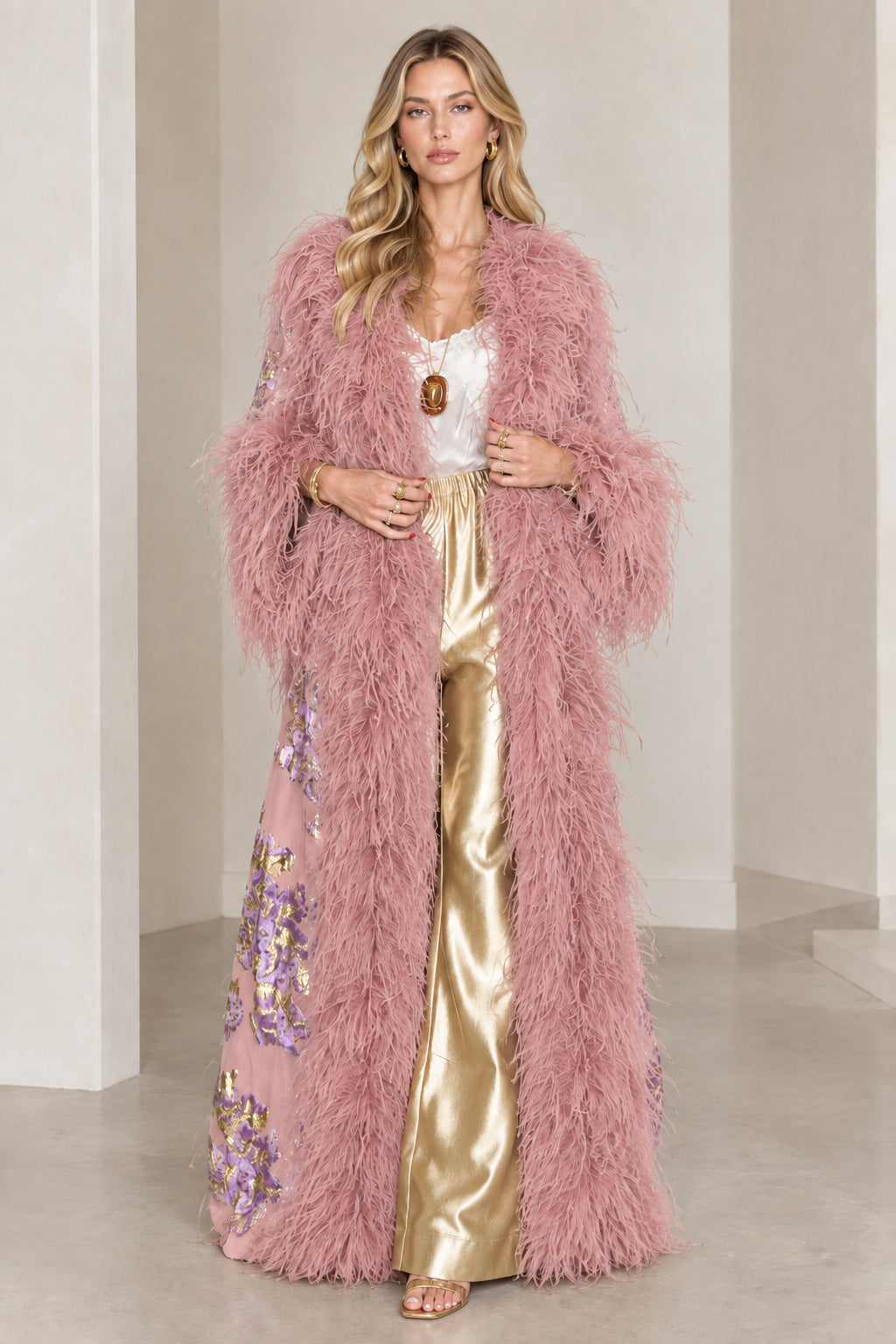 Full-length view of dusty pink floral brocade maxi coat with matching feather trim