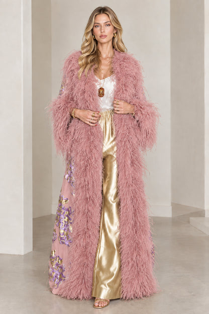 Full-length view of dusty pink floral brocade maxi coat with matching feather trim