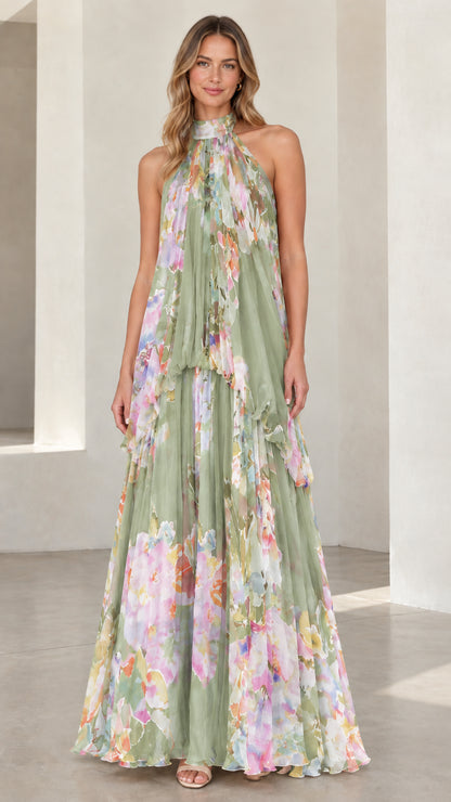 Front view of sage green floral halter neck tiered maxi dress