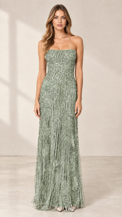 Front view of model wearing sage green strapless beaded fringe evening gown