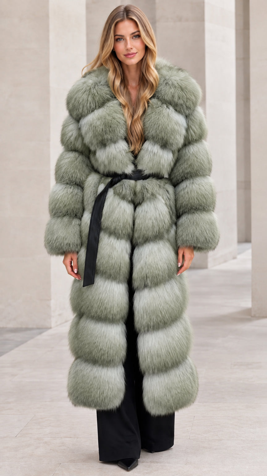 Front full-length view of woman wearing sage green long tiered faux fur coat with belt