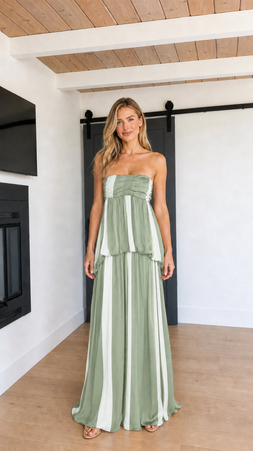 Front view of model wearing Sage Green and white striped strapless maxi dress