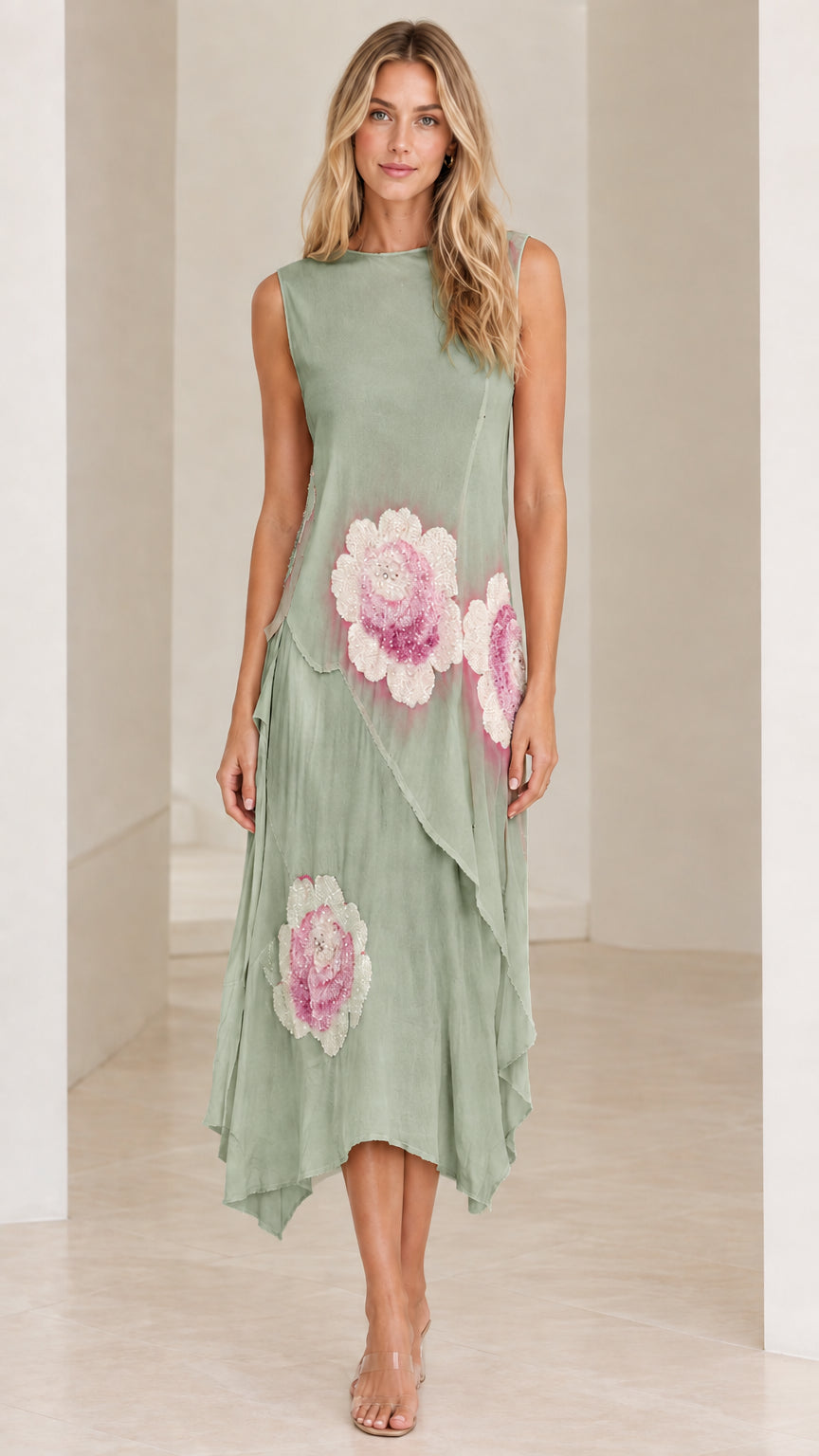 Model wearing Sage Green sleeveless floral embroidered handkerchief dress