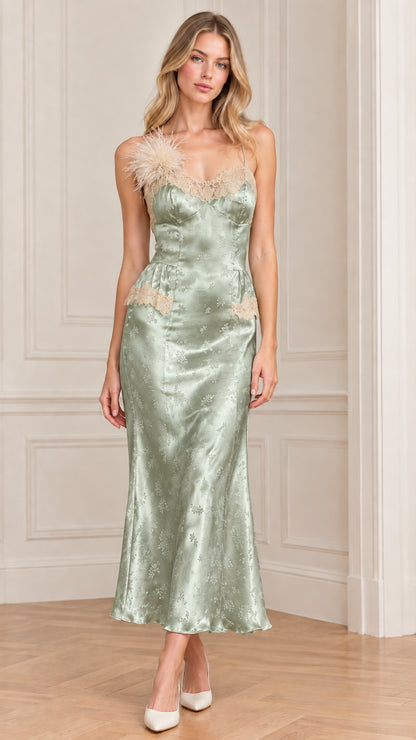 Front full-length view of woman wearing sage green satin jacquard slip dress with lace trim
