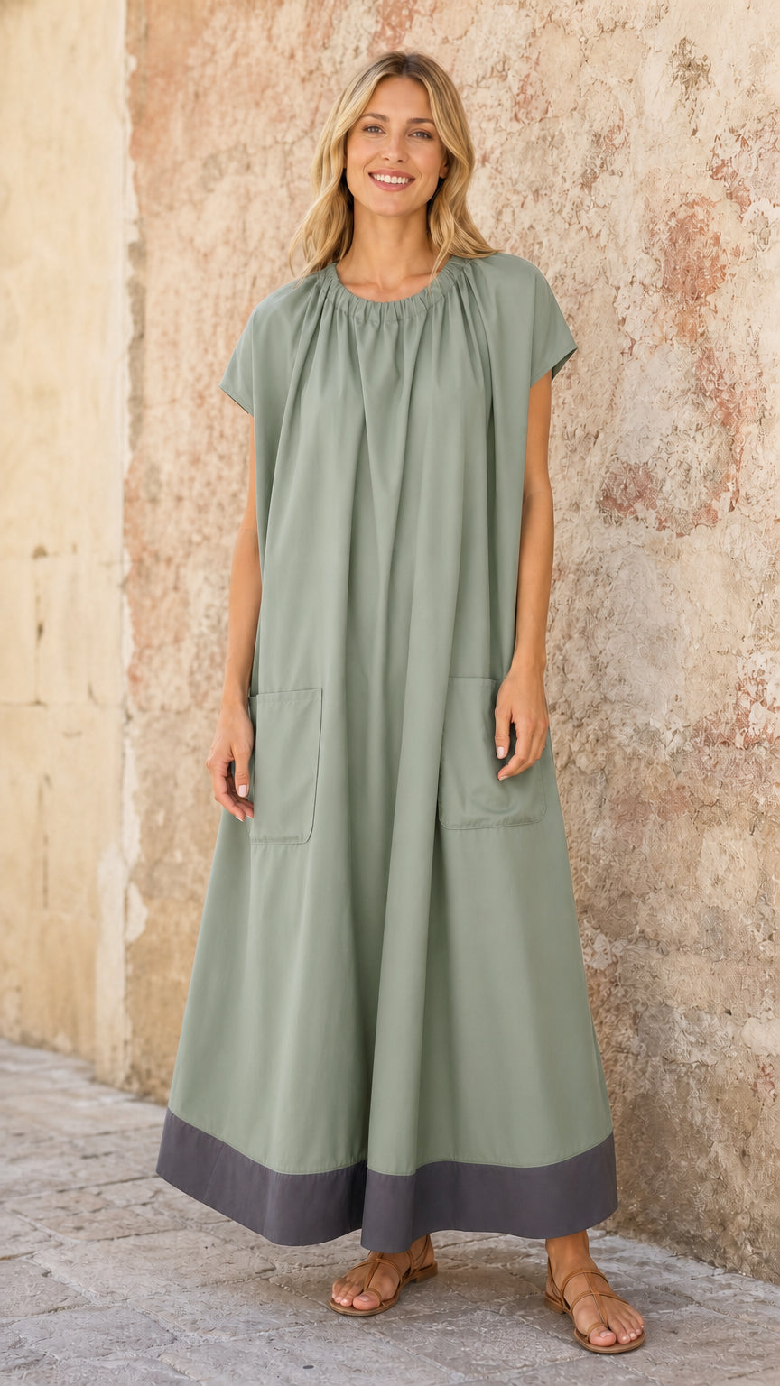 Model wearing Sage Green short sleeve caftan maxi dress with side pockets