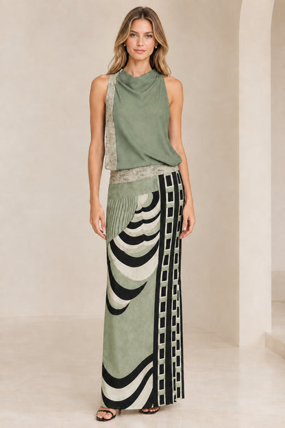 Front view of model wearing sage green abstract geometric print maxi dress