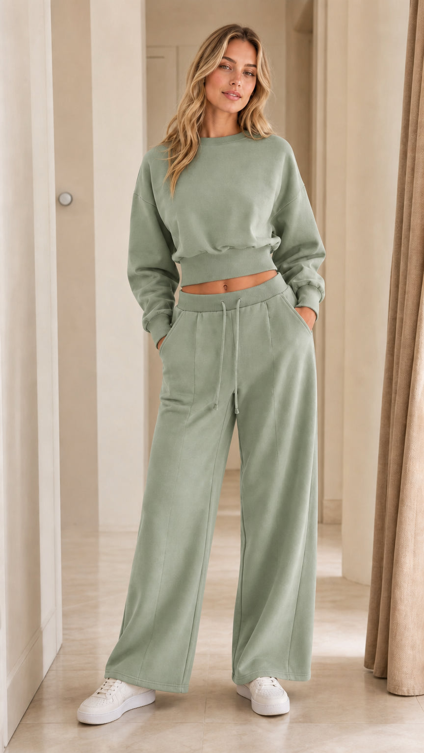 Woman wearing sage green two-piece cropped sweatshirt and wide-leg pants set