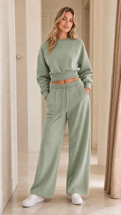 Woman wearing sage green two-piece cropped sweatshirt and wide-leg pants set