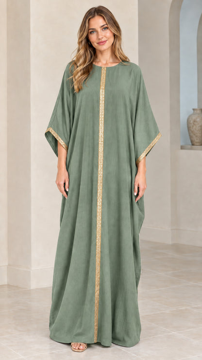 Full front view of model wearing sage green kaftan maxi dress with gold trim
