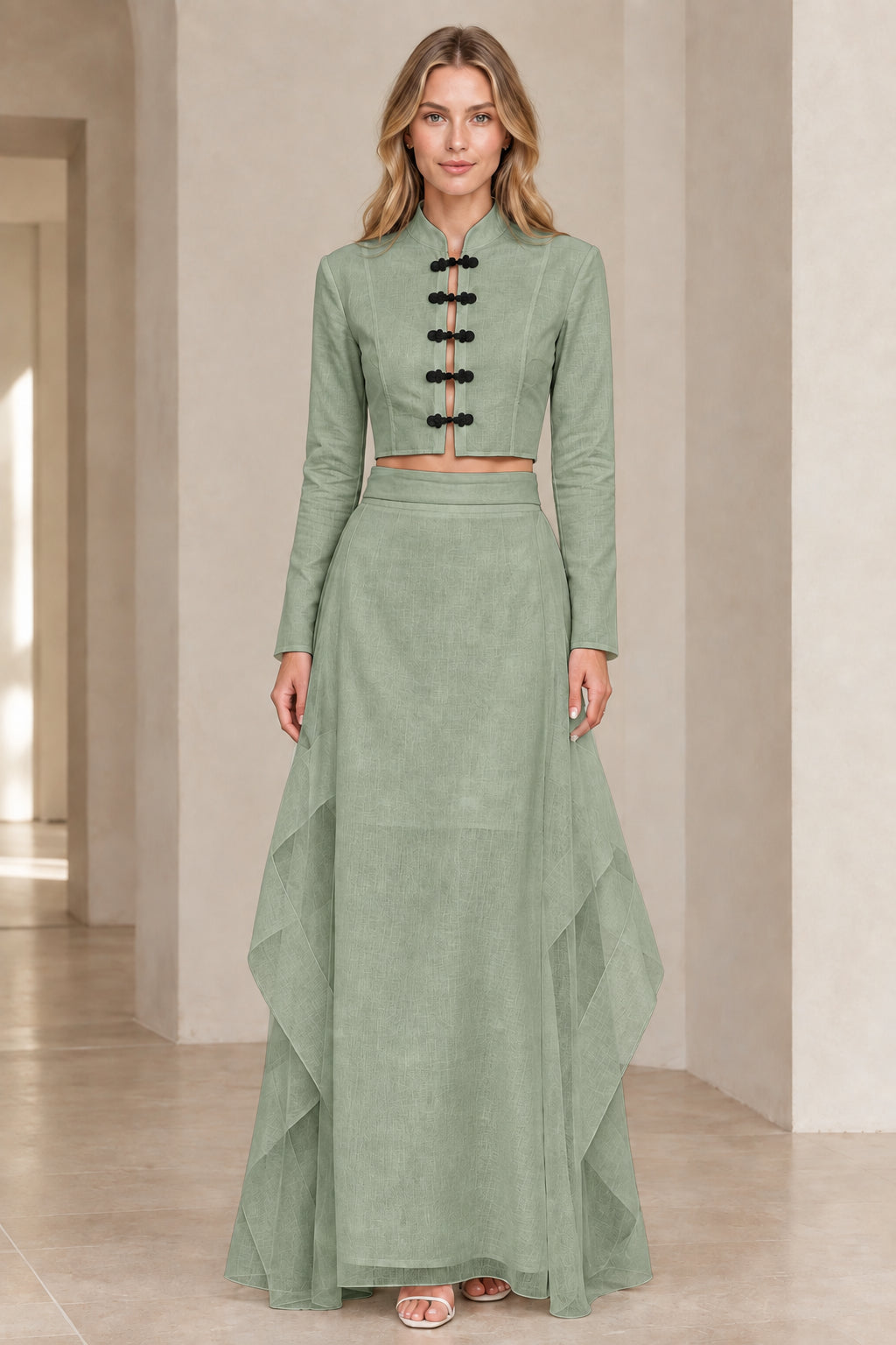 Front view of model wearing sage green mandarin collar crop top and tiered maxi skirt set