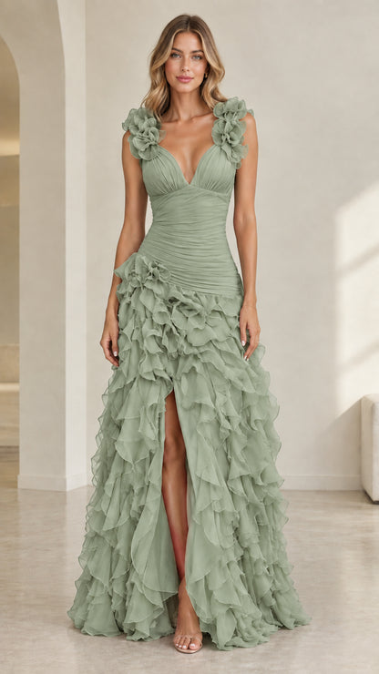 Model wearing sage green sleeveless ruffled formal gown with slit