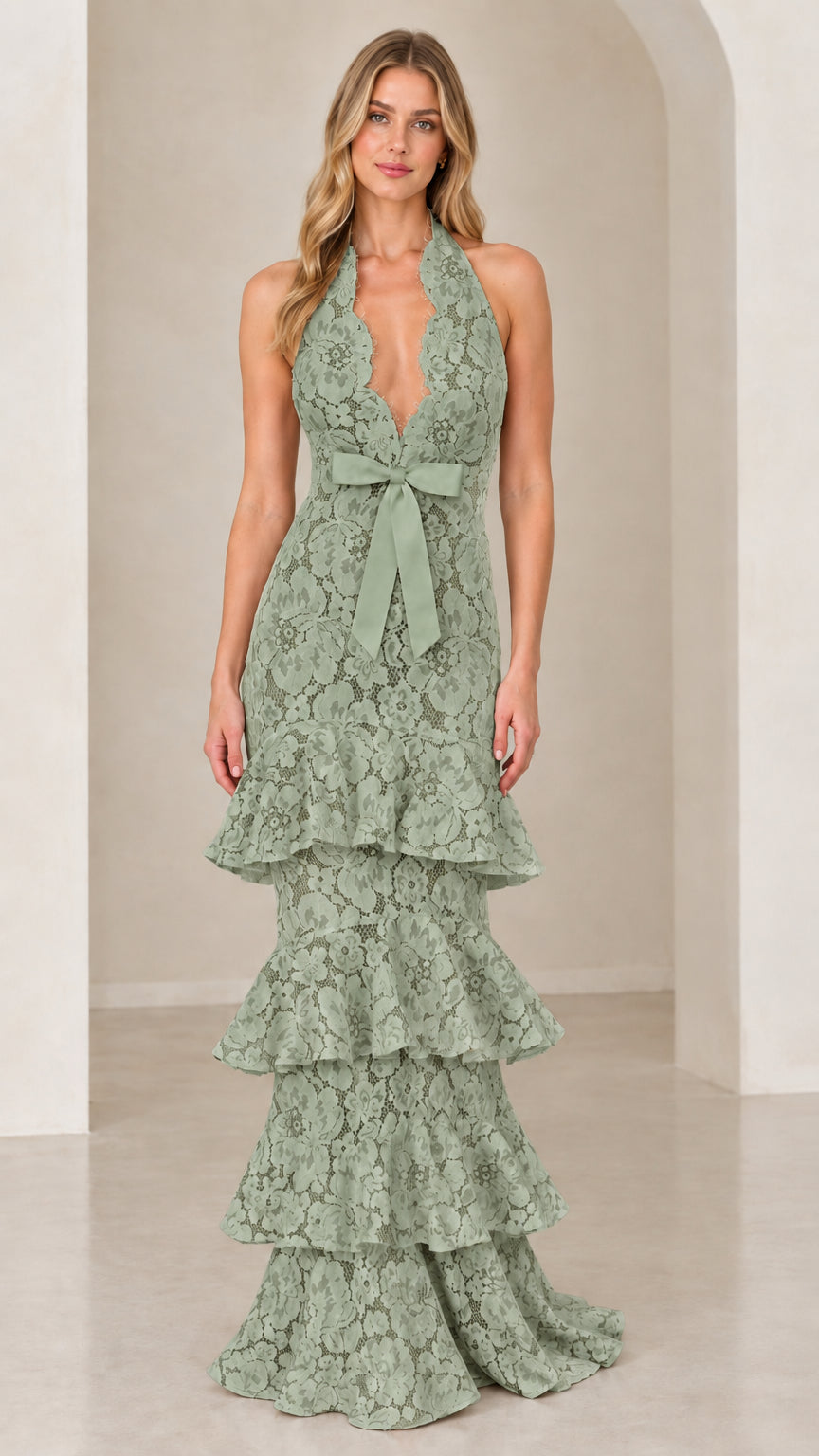 Front view of model wearing Sage Green halter tiered floral lace evening dress