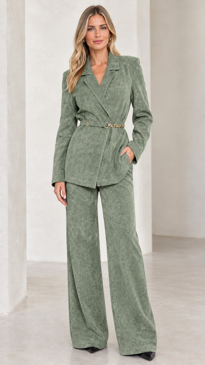 Front view of women's sage green belted blazer and wide leg pants two-piece suit set