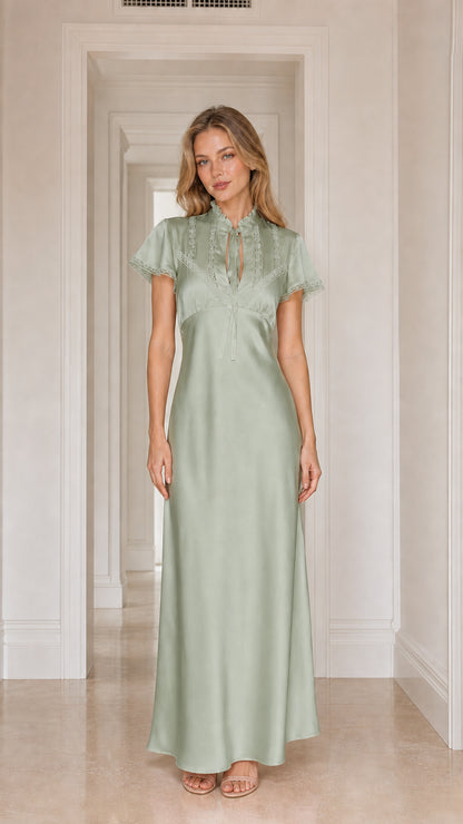 Model wearing sage satin lace-trim maxi dress
