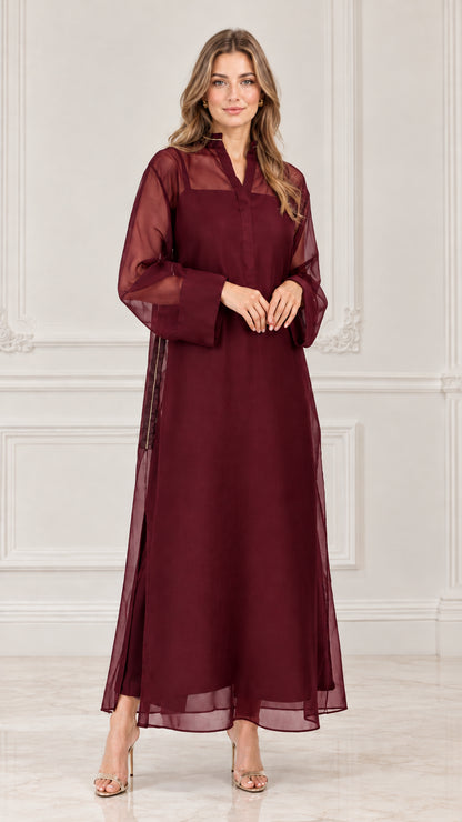 Model wearing burgundy red sheer overlay long sleeve maxi dress