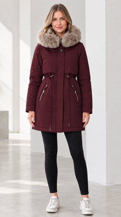 Front view of model wearing burgundy wine faux fur hooded winter parka