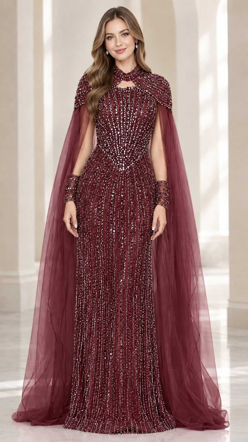 Front view of burgundy beaded maxi dress with sheer cape