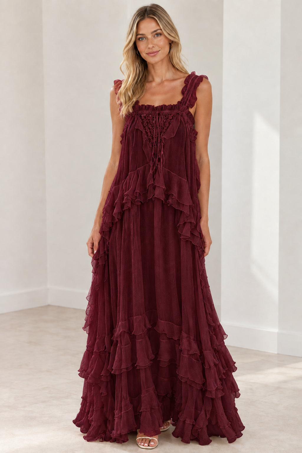 Model wearing burgundy wine tiered ruffle lace-up maxi dress