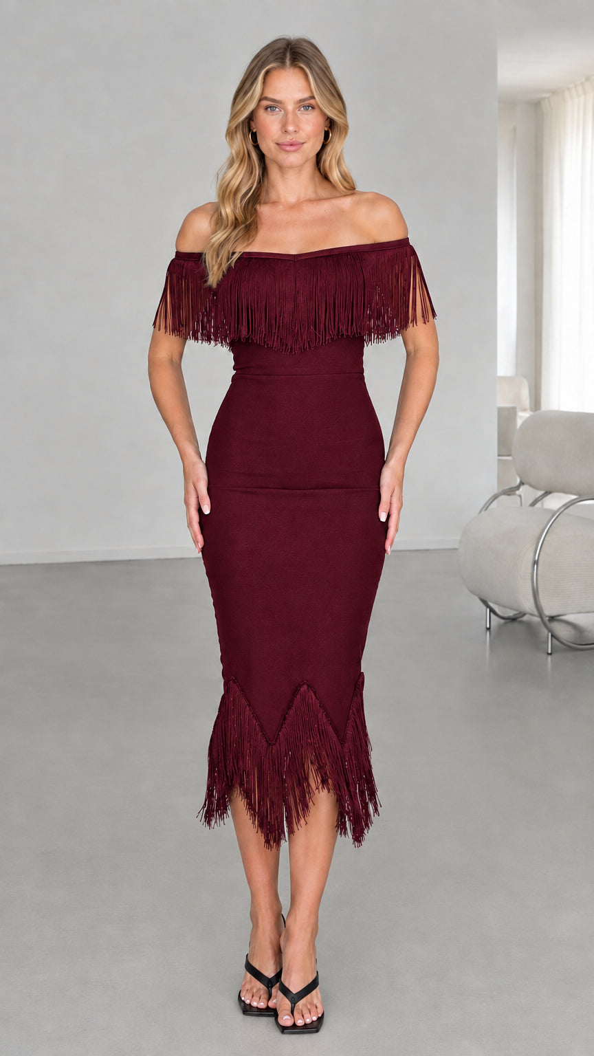 Model wearing burgundy off-the-shoulder fringe midi dress