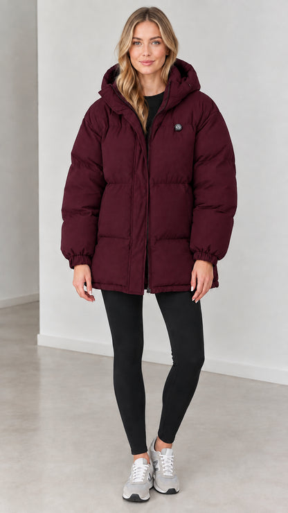 Front view of woman wearing burgundy wine hooded quilted puffer coat