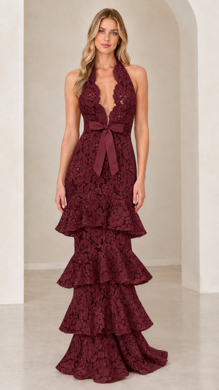 Front view of model wearing Burgundy wine halter tiered floral lace maxi gown