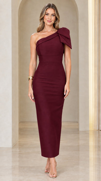 Model wearing burgundy wine one-shoulder bow column maxi dress