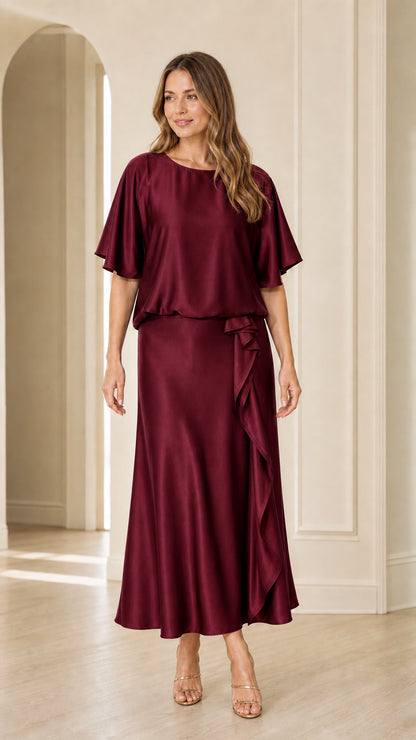 Front view of woman wearing burgundy wine satin flutter sleeve maxi dress